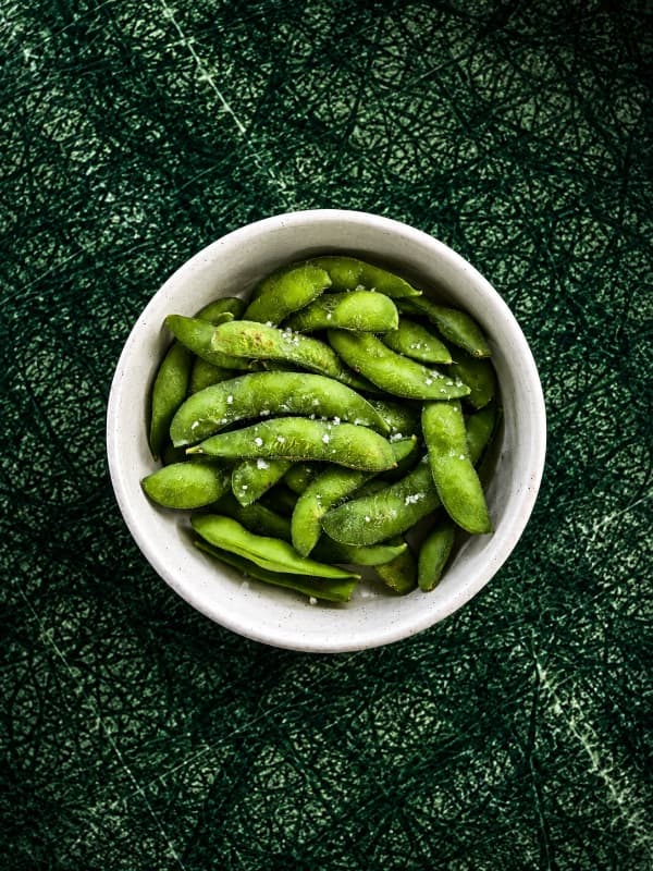 Edamame — Steamed young soybeans lightly sprinkled with sea salt for a simple, satisfying bite. A healthy and 