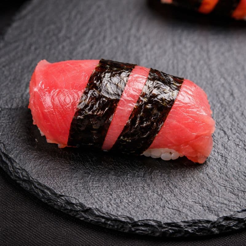 Nigiri Tekka — Pressed rice topped with a slice of fresh tuna