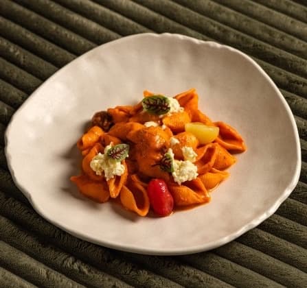 Tomato Stracciatella rigatte — Rigatte pasta tossed in creamy tomato-ricotta sauce and finished with delicate stracciatella cheese.