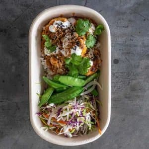Thai Chicken Red Curry Meatball — Garlic & ginger chicken meatballs, fragrant red curry sauce, sugar snap peas, shredded fresh veg, pi