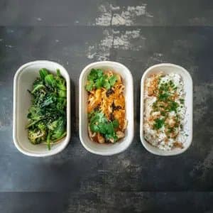 Thai Red Chicken Curry Set — 300g poached chicken breast, fragrant red curry sauce, coriander, crispy chilli oil. Choice of white