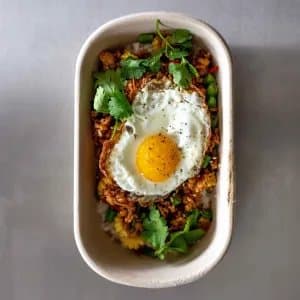 Jack's Chicken Pad Kra Pao — Chicken mince, thai basil, chilli, kra pao sauce, baby corn, green beans, fried egg, crispy shallot,