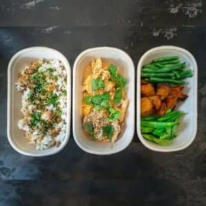 Coconut & Peanut Chicken Set — 300g poached chicken, coconut & peanut sauce, roasted peanuts, coriander. Choice of white or brown r