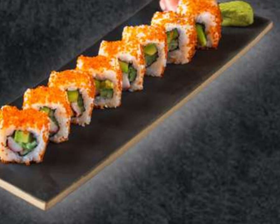 California Roll — Rice, nori, sesame seeds, crab stick, mayonnaise, avocado, cucumber, tobikko