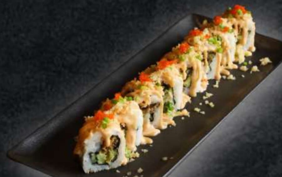 Crunch Skin Salmon — Rice, nori, fried salmon skin, avocado, cucumber, teriyaki mayo, spicy mayo, crunchy topping, tobikk