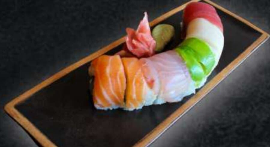 Niji Roll — Rice, nori, crab stick, avocado, cucumber, mayonnaise, tuna, salmon, snapper, butterfish