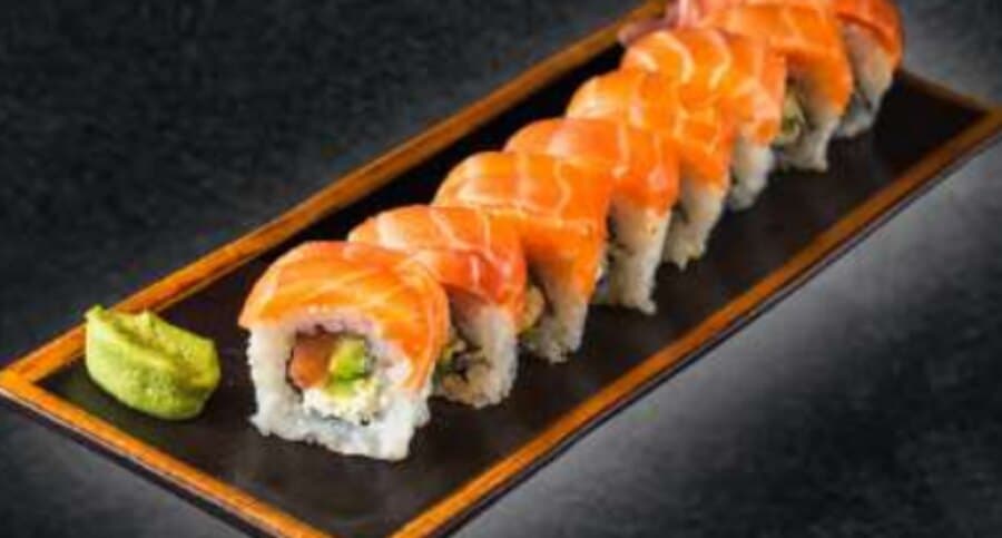 Niseko Cheese Roll — Rice, nori, sesame seeds, cream cheese, avocado, salmon, salmon on top