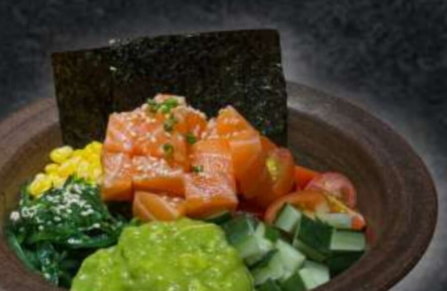 Salmon Pokebowl — Sushi rice, salmon, cuka wakame, sweet corn, edamame, cherry tomato, cucumber, mashed avocado, sesam