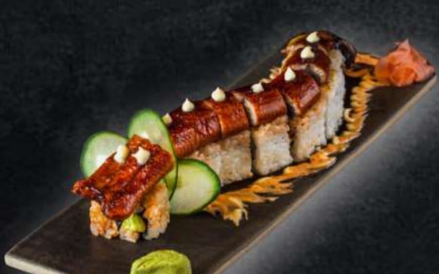 Unagi Roll — Rice, nori, sesame seeds, prawn tempura, avocado, cucumber, eel, mayonnaise, teriyaki sauce